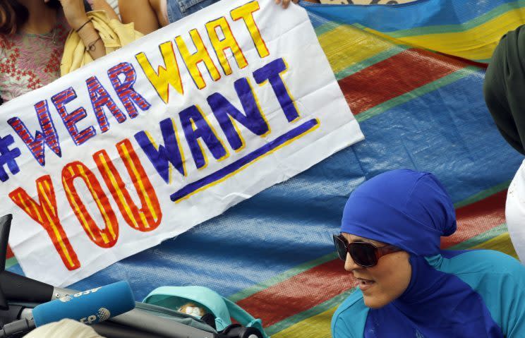 An activist protests outside the French Embassy during the "wear what you want beach party" in London, on Aug. 25, 2016. The protest was against the French clampdown on burkinis. (Photo: AP Photo/Frank Augstein)