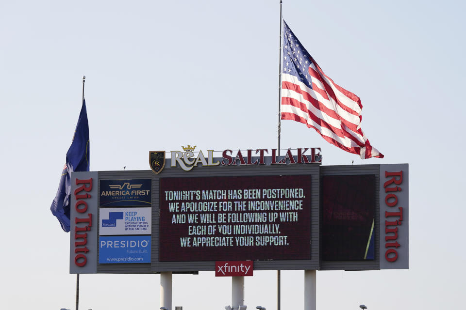 A message is on the scoreboard after the scheduled MLS soccer match between Real Salt Lake and Los Angeles FC was postponed Wednesday, Aug. 26, 2020, in Sandy, Utah. Major League Soccer players boycotted five games Wednesday night in a collective statement against racial injustice. The players' action came after all three NBA playoff games were called off in a protest over the police shooting of Jacob Blake in Wisconsin on Sunday night. (AP Photo/Rick Bowmer)