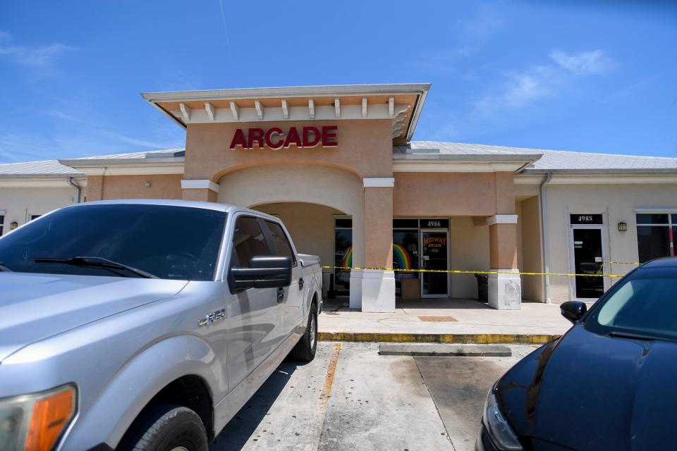 Law enforcement officers enter Midway Arcade, an adult arcade  at 4986 South 25th St., on Tuesday, May 9, 2023, in Fort Pierce, during a statewide raid of such arcades that agents discovered operated illegal slot machines. The Florida Gaming Control Commission investigates complaints against facilities that are believed to be running an illegal operation. Slot machines became illegal July 1, 2022, except at 15 approved casinos.