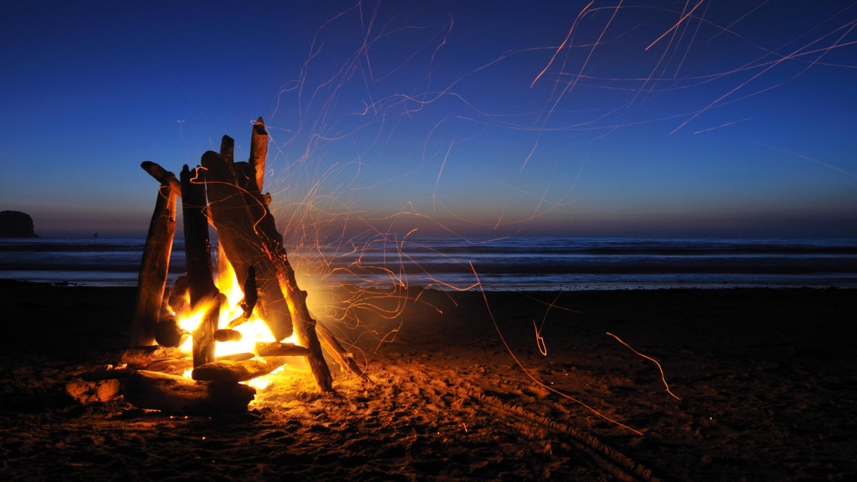  How to start a campfire: classic teepee campfire going. 