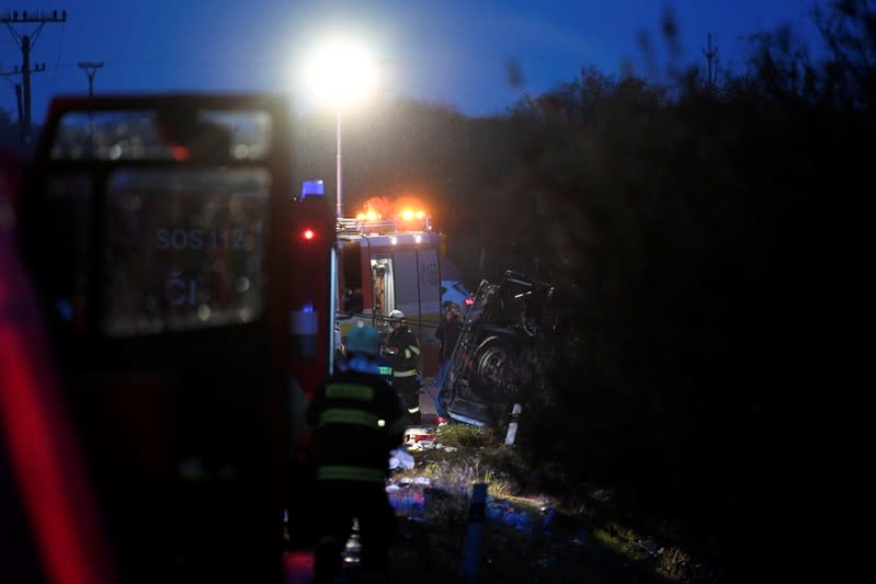 Rescue workers are seen at the site of a bus crash near the city of Nitra