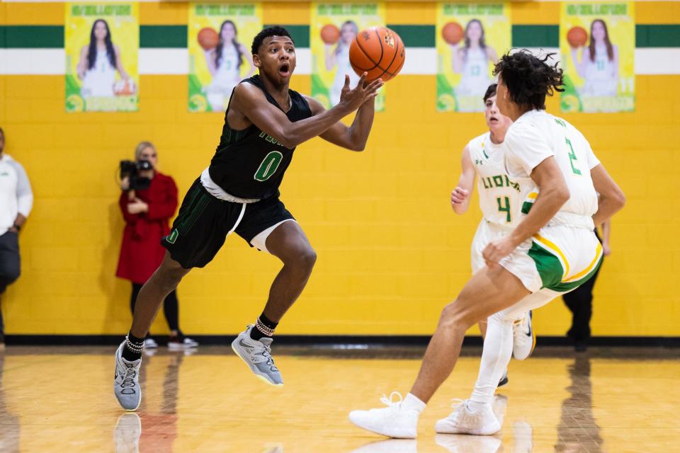 Floydada’s Ty Henderson passes the ball in a District 4-2A basketball game, Wednesday, Jan. 25, 2023, at New Deal High School in New Deal.