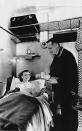 <p>This picture reveals the comforts of a woman staying in a first-class compartment on the Northern Belle, lying in her bed and receiving a professionally prepared breakfast on a tray handed to her by a train attendant. (David Meara / Amberley Publishing / <a rel="nofollow noopener" href="http://mediadrumworld.com/" target="_blank" data-ylk="slk:mediadrumworld.com;elm:context_link;itc:0;sec:content-canvas" class="link ">mediadrumworld.com</a>) </p>