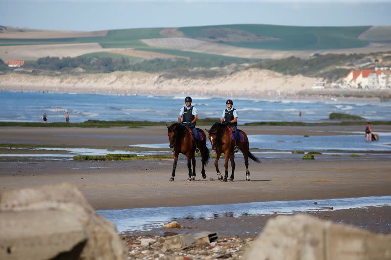 French gendarmes patrol the beach in Tardinghen