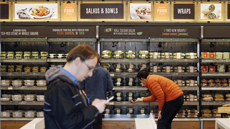The Amazon employees-only Amazon Go store in Seattle uses a tracking system with sensors and cameras to determine what a customer has bought without anyone ever having to scan an item. Source: AP Photo/Elaine Thompson, File