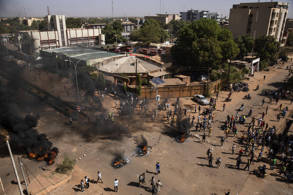 Protestors take to the streets of Burkina Faso's capital Ouagadougou Saturday Nov. 27, 2021, calling for President Roch Marc Christian Kabore to resign. The protest comes after the deadliest attack in years against the security forces in the Sahel's Soum province earlier this month, where more than 50 security forces were killed and after an attack in the Center North region where 19 people including nine members of the security forces were killed. (AP Photo/Sophie Garcia)