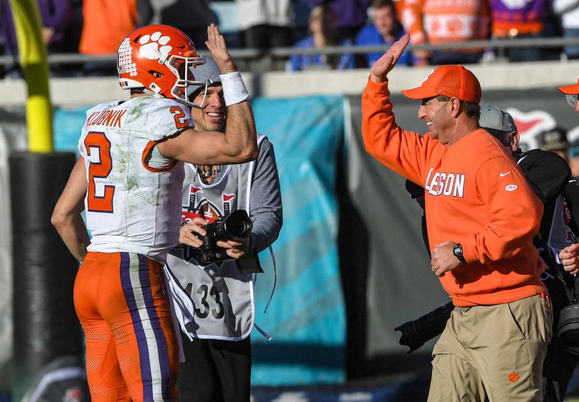 Clemson quarterback Cade Klubnik (2) gives a high five to Head Coach Dabo Swinney after the TaxSlayer Gator Bowl at EverBank Stadium in Jacksonville, Florida, Friday, December 29, 2023. Clemson beat Kentucky 38-35. Ken Ruinard / staff/Ken Ruinard / staff / USA TODAY NETWORK