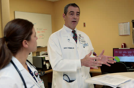 Dr. David Steinberg, Chief of Staff, Saint Joseph Mercy Health System chats with Physician Assistant Lindsay Skiff at Saint Joseph Mercy hospital in Ypsilanti, Michigan, U.S., August 23, 2017. Picture taken August 23, 2017. REUTERS/Rebecca Cook