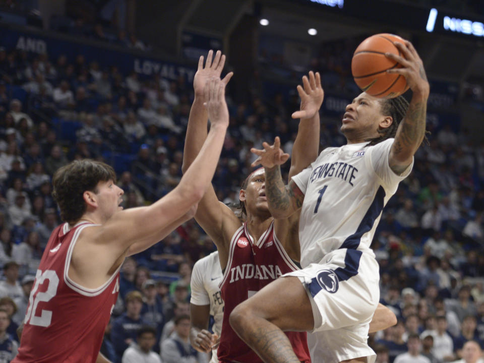 Penn State's Ace Baldwin Jr. (1) shoots over Indiana's Trey Galloway, left, and Malik Reneau, center, during the first half of an NCAA college basketball game Saturday Feb. 24, 2024, in State College, Pa. (AP Photo/Gary M. Baranec)