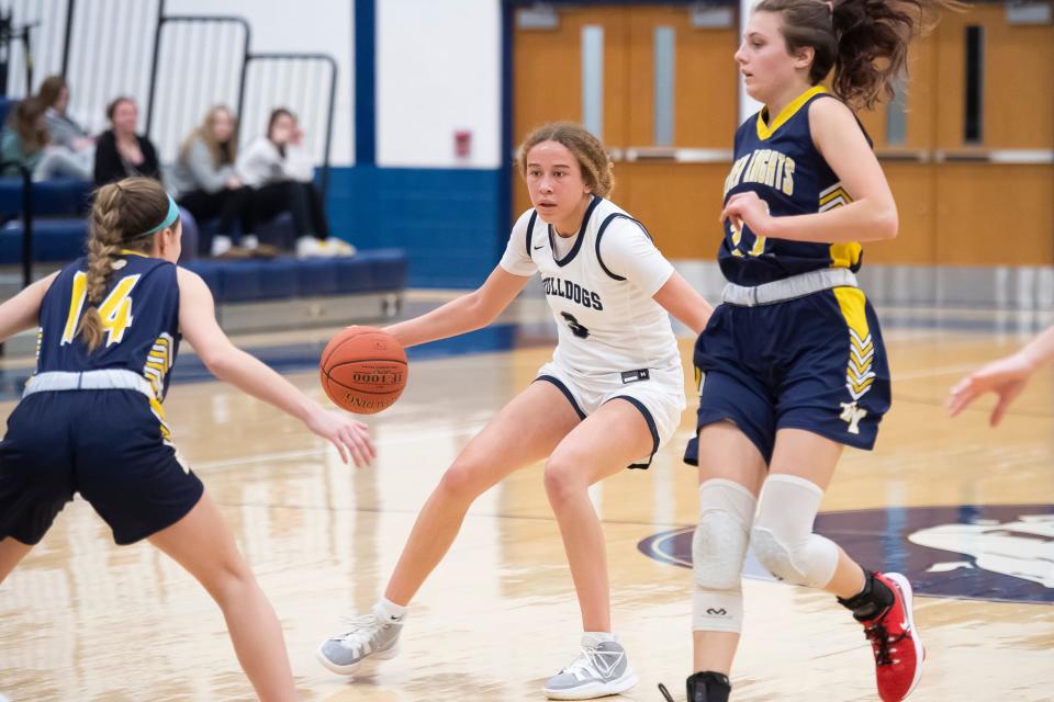 West York's Faith Walker redirects her dribble during a YAIAA Division II basketball game against Eastern York at West York Area High School on Friday, January 27, 2023. The Bulldogs won in overtime, 42-40.
