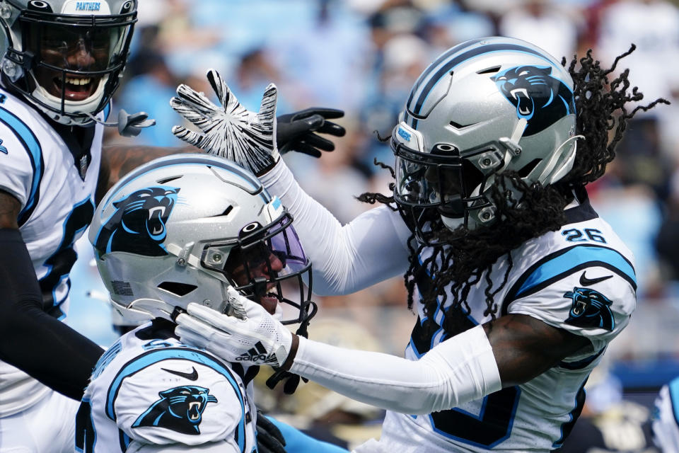 Carolina Panthers defensive end Brian Burns celebrates after a sack with cornerback Donte Jackson during the second half of an NFL football game against the New Orleans Saints Sunday, Sept. 19, 2021, in Charlotte, N.C. (AP Photo/Jacob Kupferman)