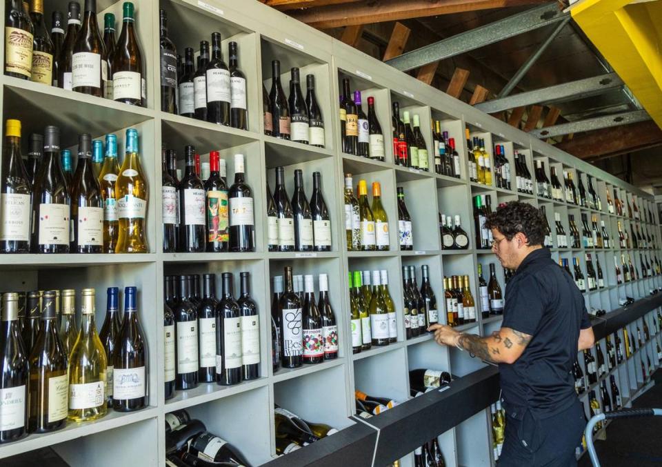 Jensen’s at Sunset Corners’ manager Robert Rosales works on the inventory on June 1, 2024, at the landmark family business that was recently bought by Eddie Cruz of Miami’s Jensen’s. The store is at 8701 Sunset Dr., in Miami