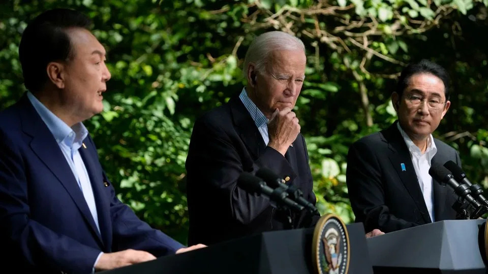 President Joe Biden and Japan's Prime Minister Fumio Kishida (right), listen as South Korea's President Yoon Suk Yeol speaks during a news conference at Camp David on August 18, 2023. - Andrew Harnik/AP