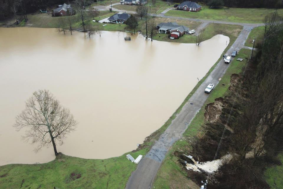 FILE - In this Feb. 11, 2020, file, aerial drone photo provided by the Mississippi Emergency Management Agency shows a potential dam/levee failure in the Springridge Place subdivision in Yazoo County, Miss. Heavy rains and recent flooding across the Southeastern U.S. have highlighted a potential public safety concern for some dams. An Associated Press review has identified hundreds of high hazard dams in the South that lack formal emergency action plans. (David Battaly/Mississippi Emergency Management Agency via AP, File)