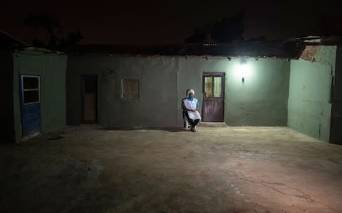 Rahmatu, a trained midwife, opens up her home in the evenings to women wanting to discreetly access contraception - Credit: Simon Townsley/The Telegraph