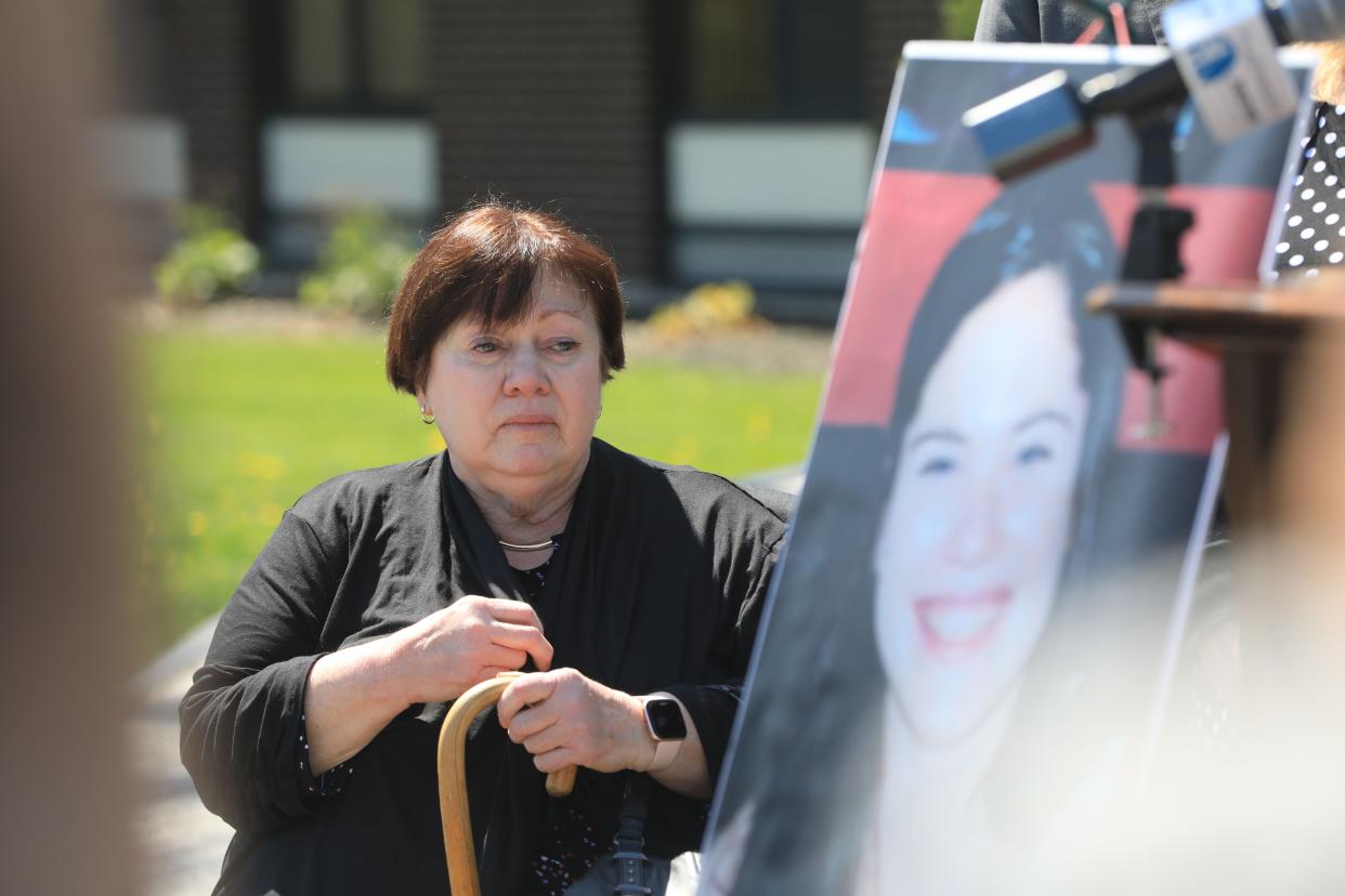 Elizabeth McDonald, mother of Megan sits beside a photo of her slain daughter during a press conference about the arrest of Edward Holley on April 20, 2023. Holley is being charged for the 2003 murder of Megan McDonald. 