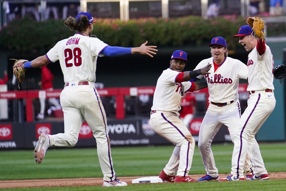 The Philadelphia Phillies celebrate a win over the Atlanta Braves after Game 4 of baseball's National League Division Series, Saturday, Oct. 15, 2022, in Philadelphia. The Philadelphia Phillies won, 8-3. (AP Photo/Matt Slocum)
