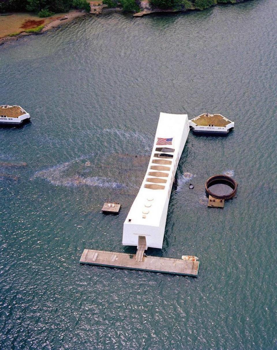 This June 15, 1984 US Navy handout photo shows an aerial view of the USS Arizona Memorial in Pearl Harbor Hawaii. Seventy-five years after Japan’s surprise attack on Pearl Harbor killed 2,403 Americans, the military personnel who died in the attack will be profoundly remembered, and the USS Arizona, which lies at the bottom of that harbor as a permanent memorial, will be visited. Later this month, Japanese Prime Minister Shinzo Abe will himself visit the U.S. naval base at Pearl Harbor with President Obama. He is the first Japanese leader to do so. HO/AFP/Getty Images