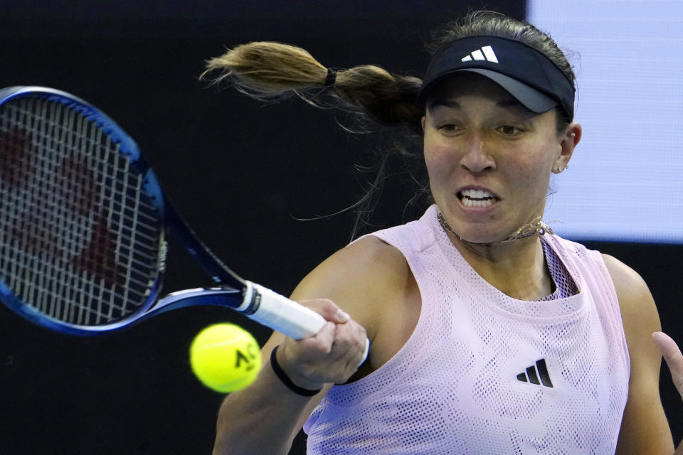 FILE - Jessica Pegula, of the U.S., plays a forehand shot during a fourth round match at the Australian Open tennis tournament, in Melbourne, Australia, on Jan. 22, 2023. She has revealed that her mother, Buffalo Bills and Sabres co-owner Kim Pegula, went into cardiac arrest in June and is "improving every day" as she deals with significant language and memory issues. (AP Photo/Ng Han Guan, File)