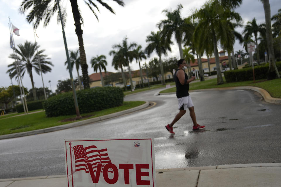 A man leaves a polling place at the Sunset Lakes Community Center as voting takes place in a special election for Florida's 20th Congressional District seat, Tuesday, Jan. 11, 2022, in Miramar, Fla. Democrat Sheila Cherfilus-McCormick, a health care company CEO, faces Republican Jason Mariner in the special election to fill the U.S. congressional seat left vacant after Democratic U.S. Rep. Alcee Hastings died last April of pancreatic cancer. (AP Photo/Rebecca Blackwell)