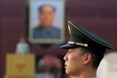 A paramilitary officer keeps watch in Tiananmen Square in Beijing