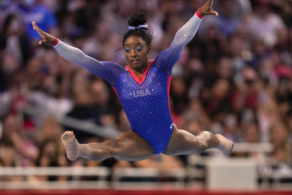 FILE - Simone Biles competes in the floor exercise during the women's U.S. Olympic Gymnastics Trials in St. Louis, in this Friday, June 25, 2021, file photo. Three-quarters of the 613-person U.S. Olympic team that was released Tuesday competed in the American collegiate system — the most up-to-date number to illustrate the country's dependence on NCAA and other college programs to bring home medals. Biles, who is a top contender for multiple gold medals, is making her second Olympic appearance. (AP Photo/Jeff Roberson, File)