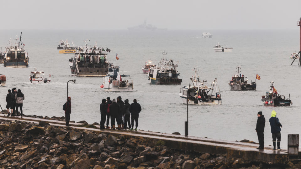 Fishing vessels at sea off the coast of Jersey, Thursday, May 6, 2021. French fishermen angry over loss of access to waters off their coast have gathered their boats in protest off the English Channel island of Jersey. The head of a grouping of Normandy fishermen said about 50 boats from French ports joined the protest Thursday morning and gathered their fleet off the Jersey port of St. Helier. (Oliver Pinel via AP)