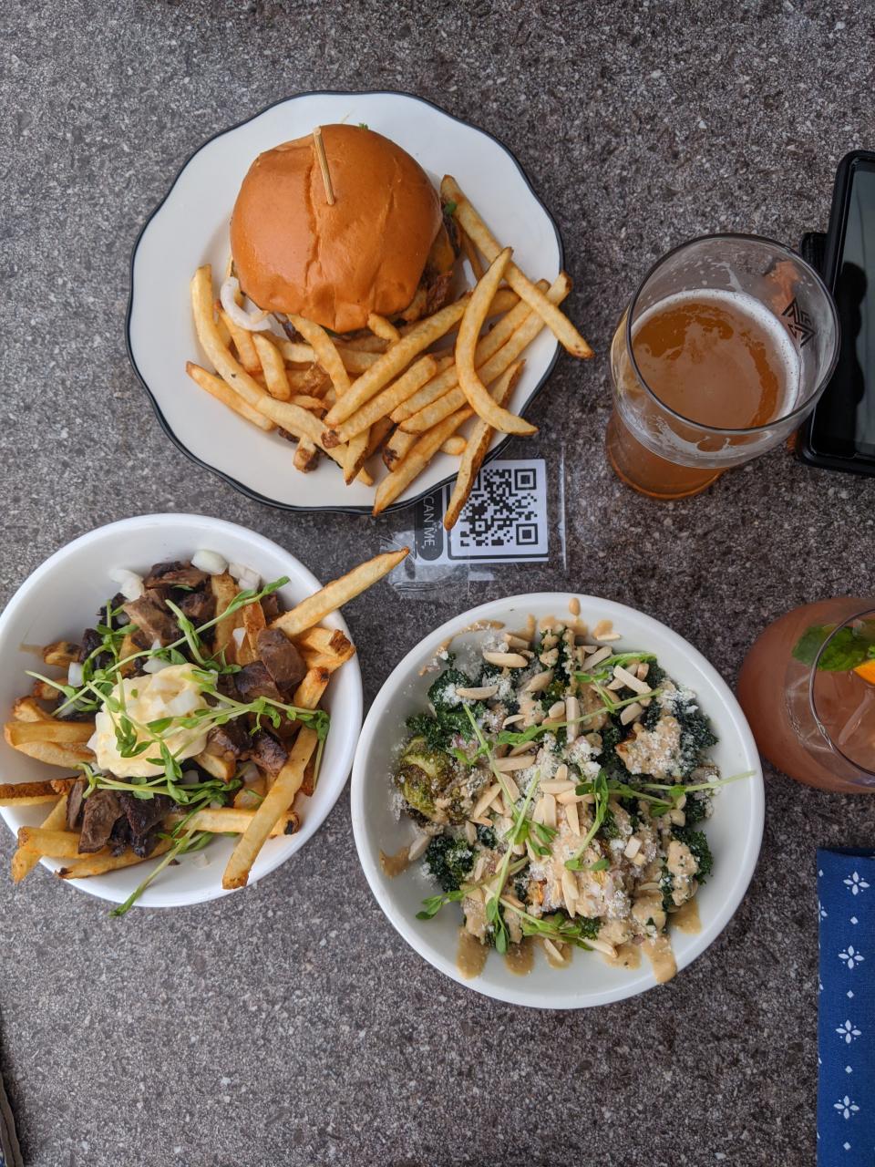 The Donder Fries, burger and kalette and Brussels sprouts salad at Monnik Beer Co. in Louisville.