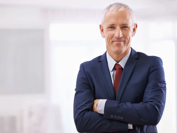 Cropped shot of a mature businessman with folded arms