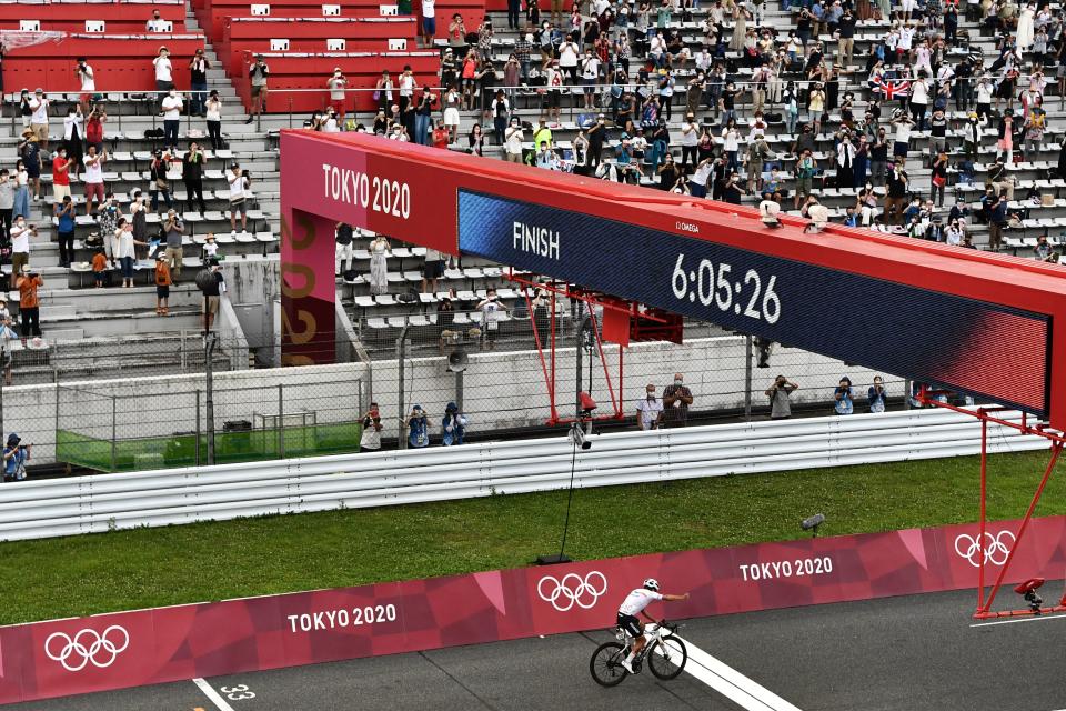 Fans in the stands at the end of the cycling race. (Jeff Pachoud / Getty Images)