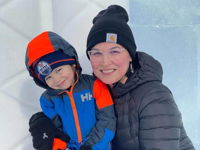 Melanie Dene and her son K&#xee;hew Aw&#xe2;sis. Dene returned to Yellowknife after getting a master&#39;s degree at the University of Alberta, but the challenge of finding housing for herself and her three children has made her second guess her move North.  (Submitte by Melanie Dene - image credit)