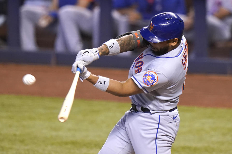 New York Mets' Dominic Smith flies out to left field during the third inning of a baseball game against the Miami Marlins, Saturday, May 22, 2021, in Miami. (AP Photo/Lynne Sladky)