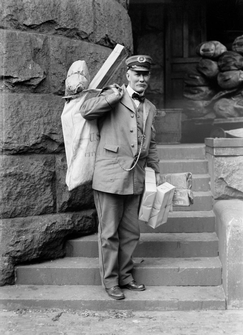 A United States Postal Service worker, circa 1914.