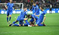 Italy's Nicolo Barella, on ground, celebrates with his teammates after scoring his side's first goal during the Euro 2020 Group J qualifying soccer match between Italy and Finland at the Friuli-Dacia Arena stadium in Udine, Italy, Saturday, March 23, 2019. (Alberto Lancia/ANSA via AP)