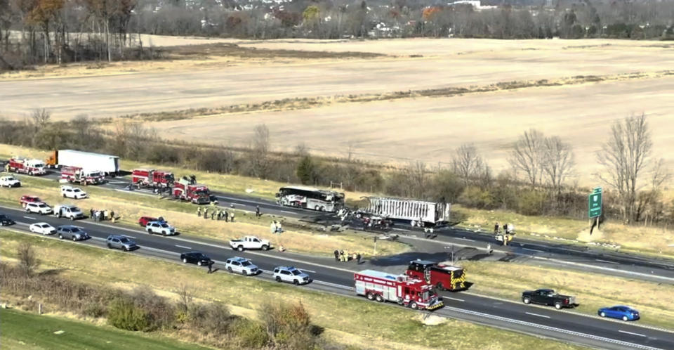 Emergency responders are on the scene of a fatal accident on Interstate 70 West in Licking County, Ohio, Tuesday, Nov. 14, 2023. An emergency official says a charter bus carrying students from a high school was rear-ended by a semi-truck on the Ohio highway. (WSYX/WTTE via AP)