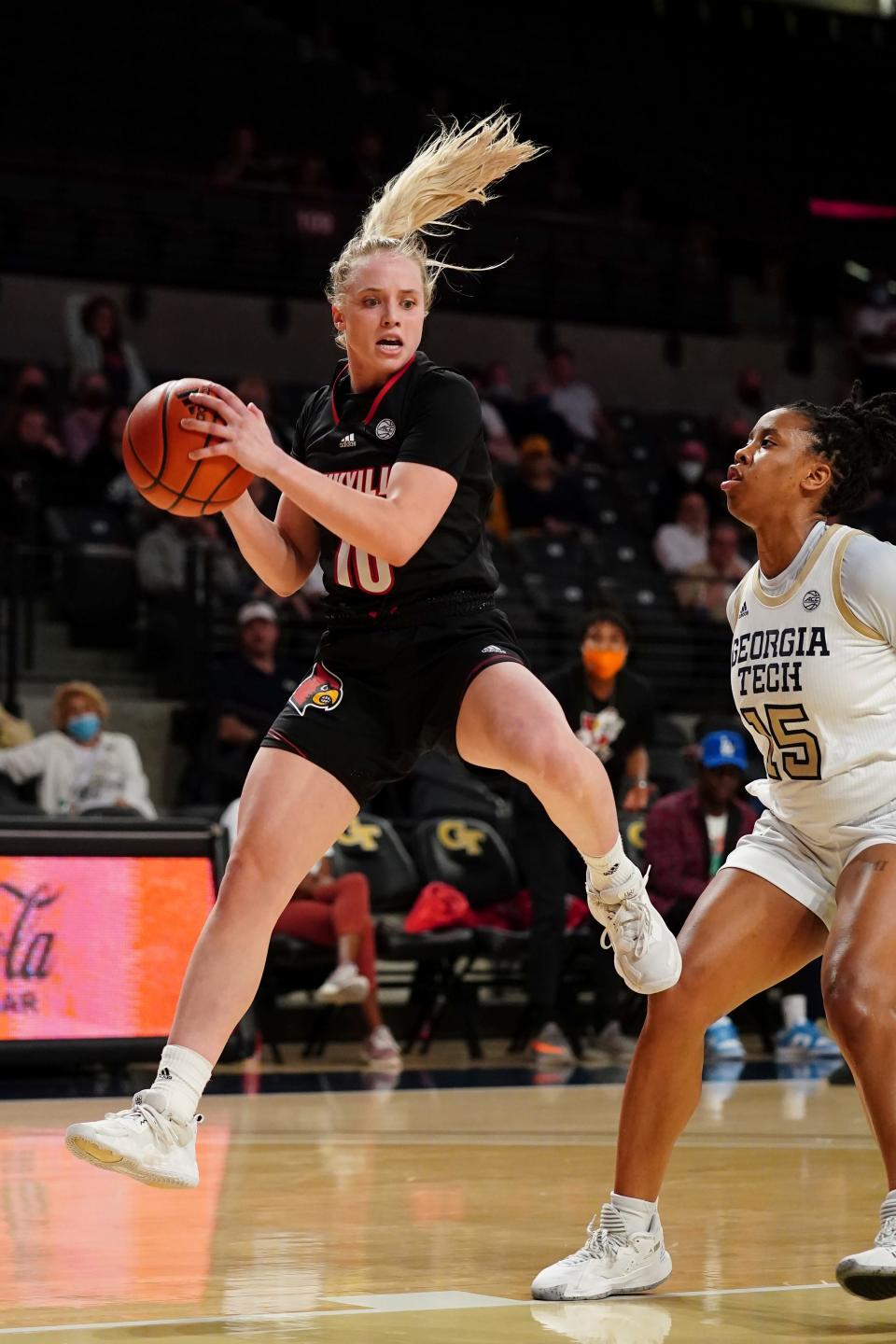 Louisville guard Hailey Van Lith (10) pulls down a rebound against Georgia Tech Avyonce Carter (15) during the first half of an NCAA college basketball game Sunday, Jan. 2, 2022, in Atlanta. (AP Photo/John Bazemore)