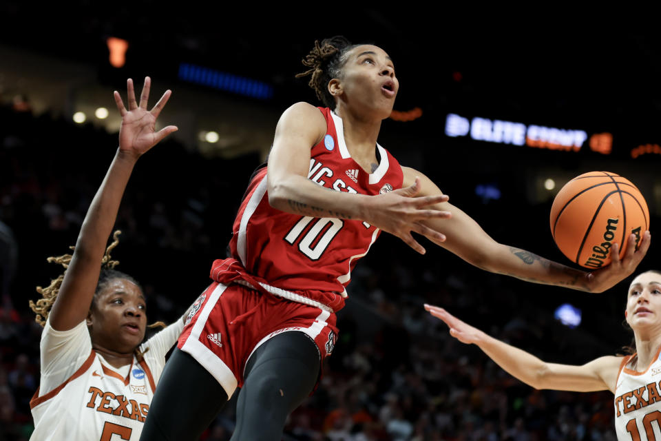PORTLAND, OREGON - MARCH 31: Aziaha James #10 of the NC State Wolfpack shoots over DeYona Gaston #5 of the Texas Longhorns during the first half in the Elite 8 round of the NCAA Women's Basketball Tournament at Moda Center on March 31, 2024 in Portland, Oregon. (Photo by Steph Chambers/Getty Images)