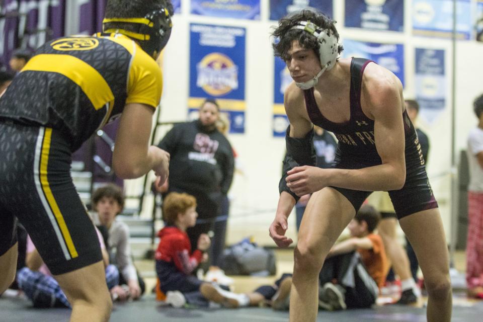 Iona Prep's Justin Shay wrestles in the 132-pound finals of the Murphy-Guccione Shoreline Classic wrestling tournament at New Rochelle High School on Saturday, Jan. 7, 2023.
