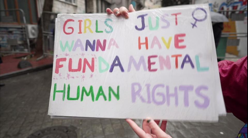 PHOTO: A protester holds a sign during a march to mark International Women's Day in Istanbul, March 8, 2024. (ABC News)