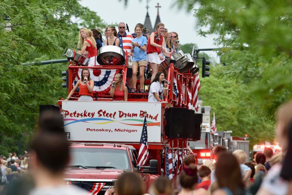 The Petoskey Steel Drum Band performs on a float during the Petoskey Fourth of July parade on Mitchell Street in downtown Petoskey on July 4, 2022.