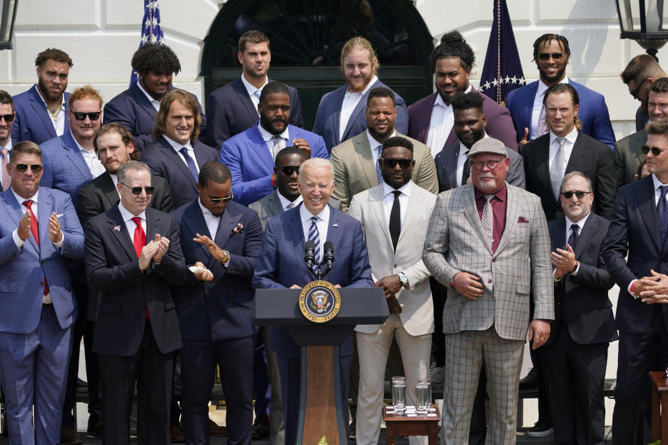 President Joe Biden, surrounded by members of the Tampa Bay Buccaneers, speaks during a ceremony on the South Lawn of the White House, in Washington, Tuesday, July 20, 2021, where the president honored the Super Bowl Champion Tampa Bay Buccaneers for their Super Bowl LV victory. (AP Photo/Andrew Harnik)