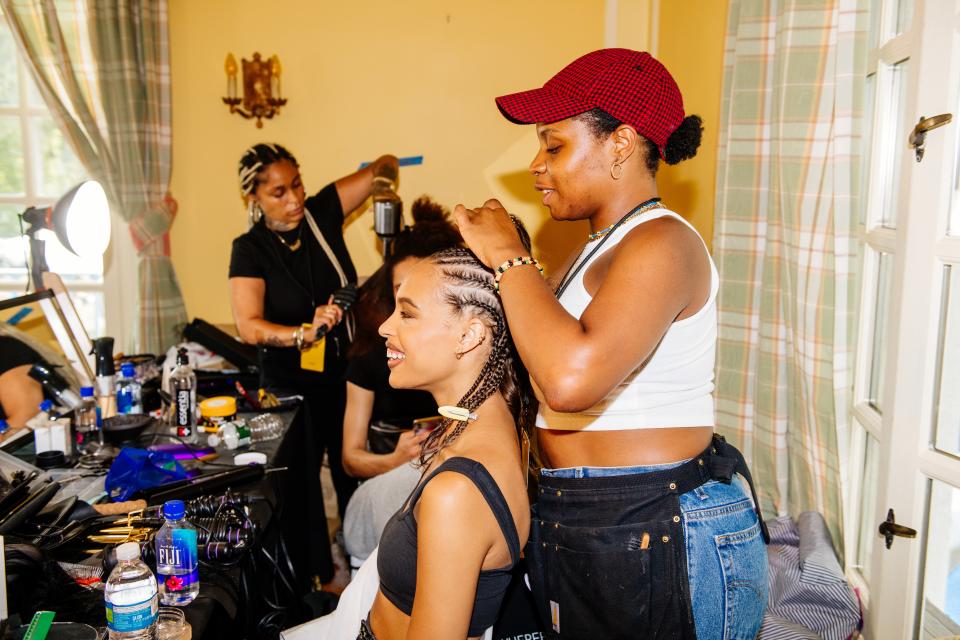 Cornrows in progress backstage at Pyer Moss.