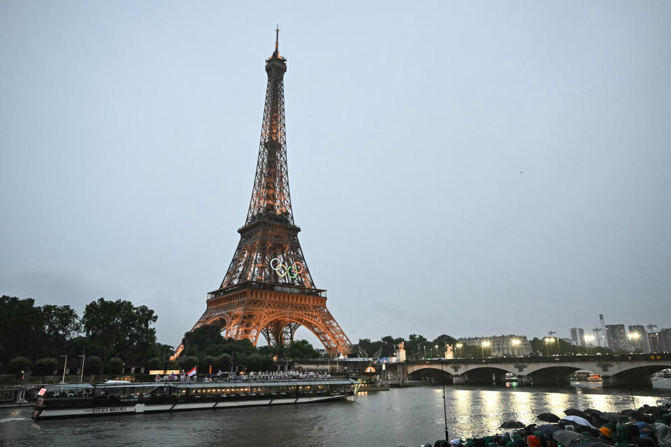 The delegations from Mexico, Micronesia, Moldova and Monaco sail in a boat along the river Seine during the opening ceremony of the Paris 2024 Olympic Games in Paris on July 26, 2024, as the Eiffel Tower is seen in the background. (Photo by Paul ELLIS / AFP) (Photo by PAUL ELLIS/AFP via Getty Images)
