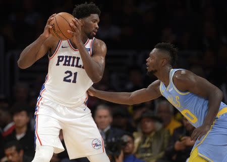 November 15, 2017; Los Angeles, CA, USA; Philadelphia 76ers center Joel Embiid (21) controls the ball against Los Angeles Lakers forward Julius Randle (30) during the second half at Staples Center. Gary A. Vasquez-USA TODAY Sports