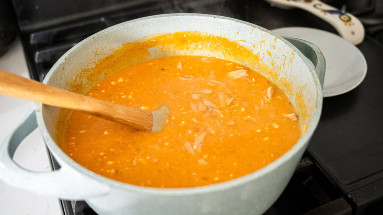 cream cheese and shredded cheese in chili