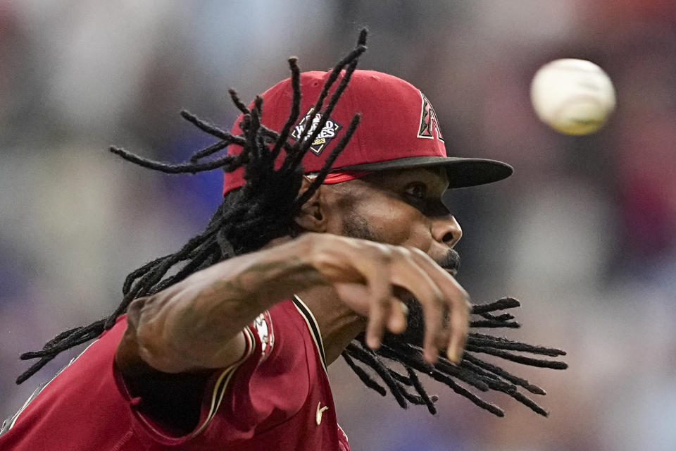 Arizona Diamondbacks relief pitcher Miguel Castro throws against the Texas Rangers during the 11th inning in Game 1 of the baseball World Series Friday, Oct. 27, 2023, in Arlington, Texas. (AP Photo/Brynn Anderson)