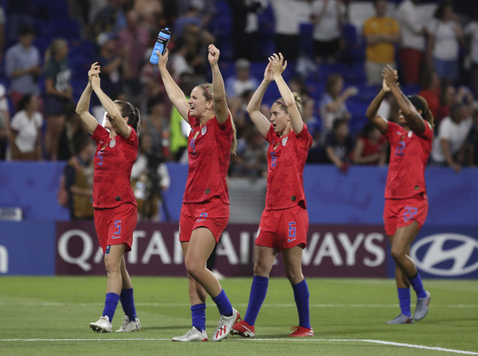 US players celebrate after the Women's World Cup semifinal soccer match between England and the United States, at the Stade de Lyon outside Lyon, France, Tuesday, July 2, 2019. US won 2-1. (AP Photo/Laurent Cipriani)