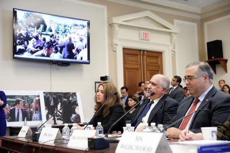 FILE PHOTO: Protesters including Murat Yusa and Lusik Usoyan testify before the House Foreign Affairs Europe, Eurasia and Emerging Threats Subcommittee about the attack on demonstrators by members of Turkish President Recep Tayyip Erdogan's security detail on Capitol Hill in Washington, D.C., U.S. May 25, 2017. REUTERS/Aaron P. Bernstein