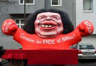 <p>A carnival float featuring the parliamentary group leader of the Social Democratic Party (SPD) Andrea Nahles is pictured during a carnival parade on Rose Monday on Feb. 12, 2018 in Duesseldorf, western Germany. Inscription reads “Comrades, the end is near / Nahles” playing on the word “nah” meaning “near” in German. (Photo: Patrik Stollarz/Getty Images) </p>