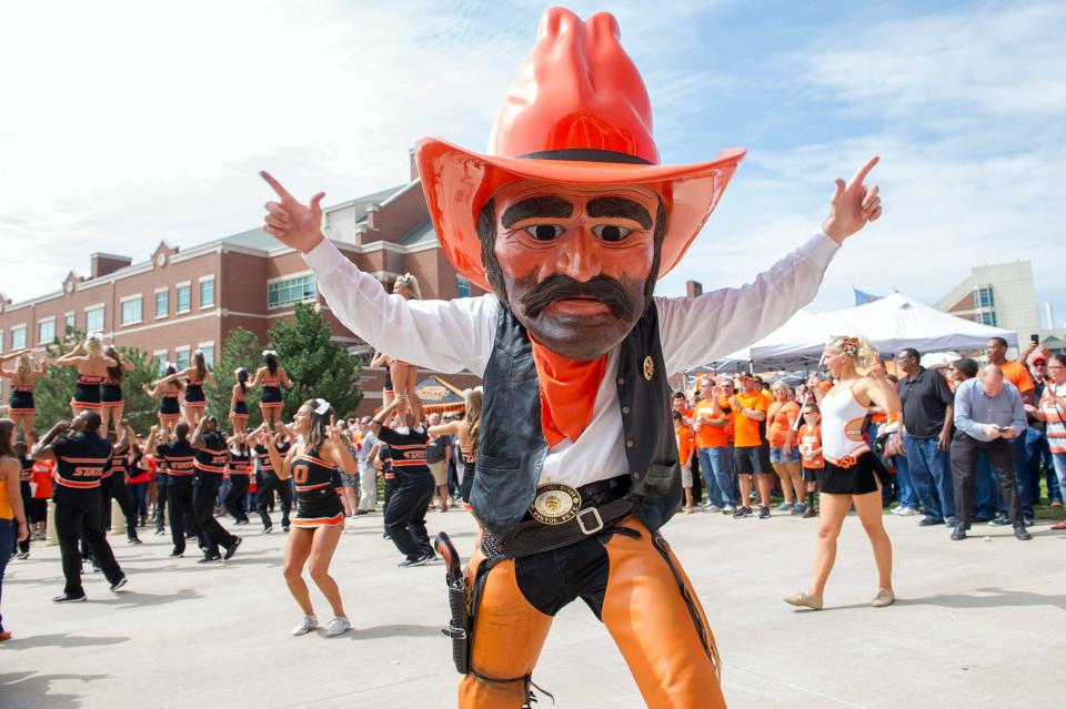 Oklahoma State mascot Pistol Pete participates in the team's walk to the stadium before its football game against Texas-San Antonio at Boone Pickens Stadium.